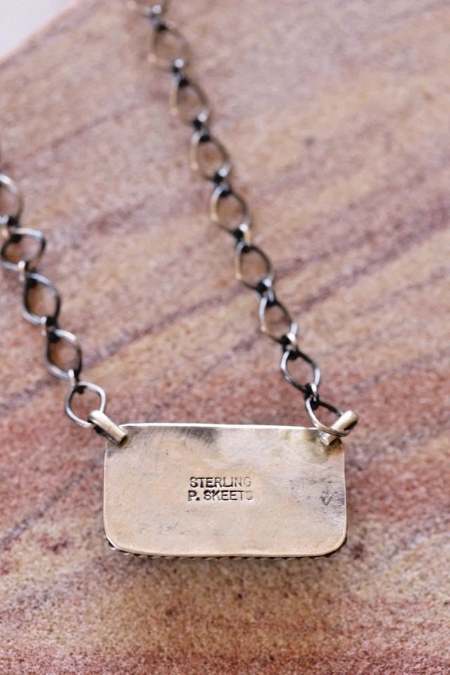 P. SKEETS NAVAJO KINGMAN TURQUOISE PENDANT NECKLACE WITH STERLING CHAIN: P. SKEETS NAVAJO KINGMAN TURQUOISE PENDANT NECKLACE WITH STERLING CHAIN Pendant is 1/2" Tall x 7/8" wide .. Sterling Chain is 18" 8.3 Grams Throughout the 40 years that I have been in business, I have