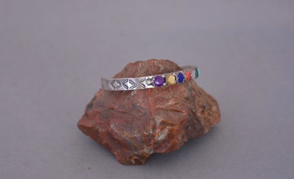 ANTOINETTE PLATERO - MULTI GEM STONE SILVER BRACELET - LAGUNA PUEBLO - 6.5": ANTOINETTE PLATERO - MULTI GEM STONE SILVER BRACELET - LAGUNA PUEBLO - 6.5" This bracelet has been beautifully crafted by Laguna Pueblo artist Antoinette Platero. It has a rainbow of 10 semi precious 
