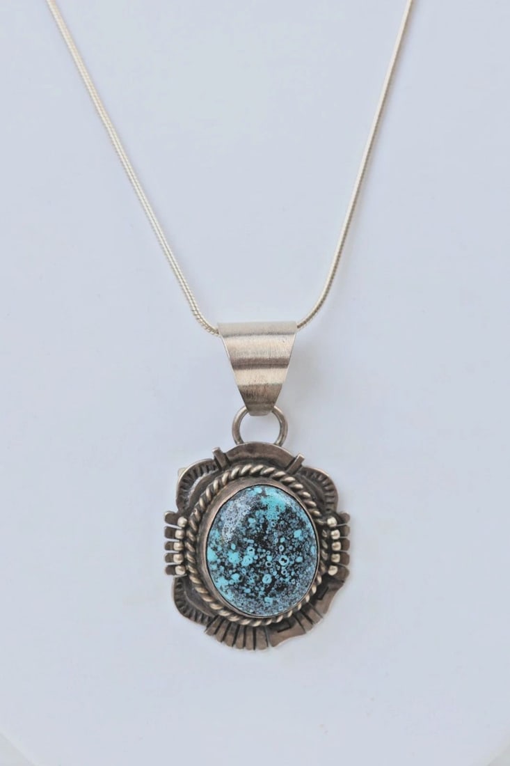 NAVAJO STERLING SILVER PENDANT NECKLACE - NO. 8 TURQUOISE - DONOVAN SKEETS: This sterling silver pendant necklace has been beautifully crafted by Navajo silversmith Donovan Skeets. The pendant has been set with a beautiful piece of No. 8 turquoise. The sterling setting has be