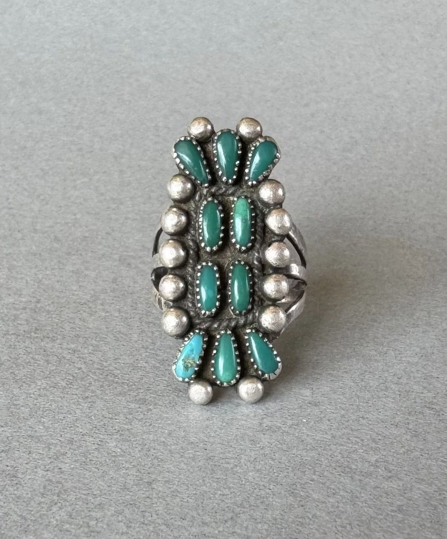 OLD PAWN ZUNI STERLING SILVER AND TURQUOISE RING SIZE 5 1/2: 1 1/4 " tall 7.4 grams Throughout the 40 years that I have been in business, I have purchased jewelry from pawn shops throughout the Southwest that had collections of dead pawn. Most of these pawn sho