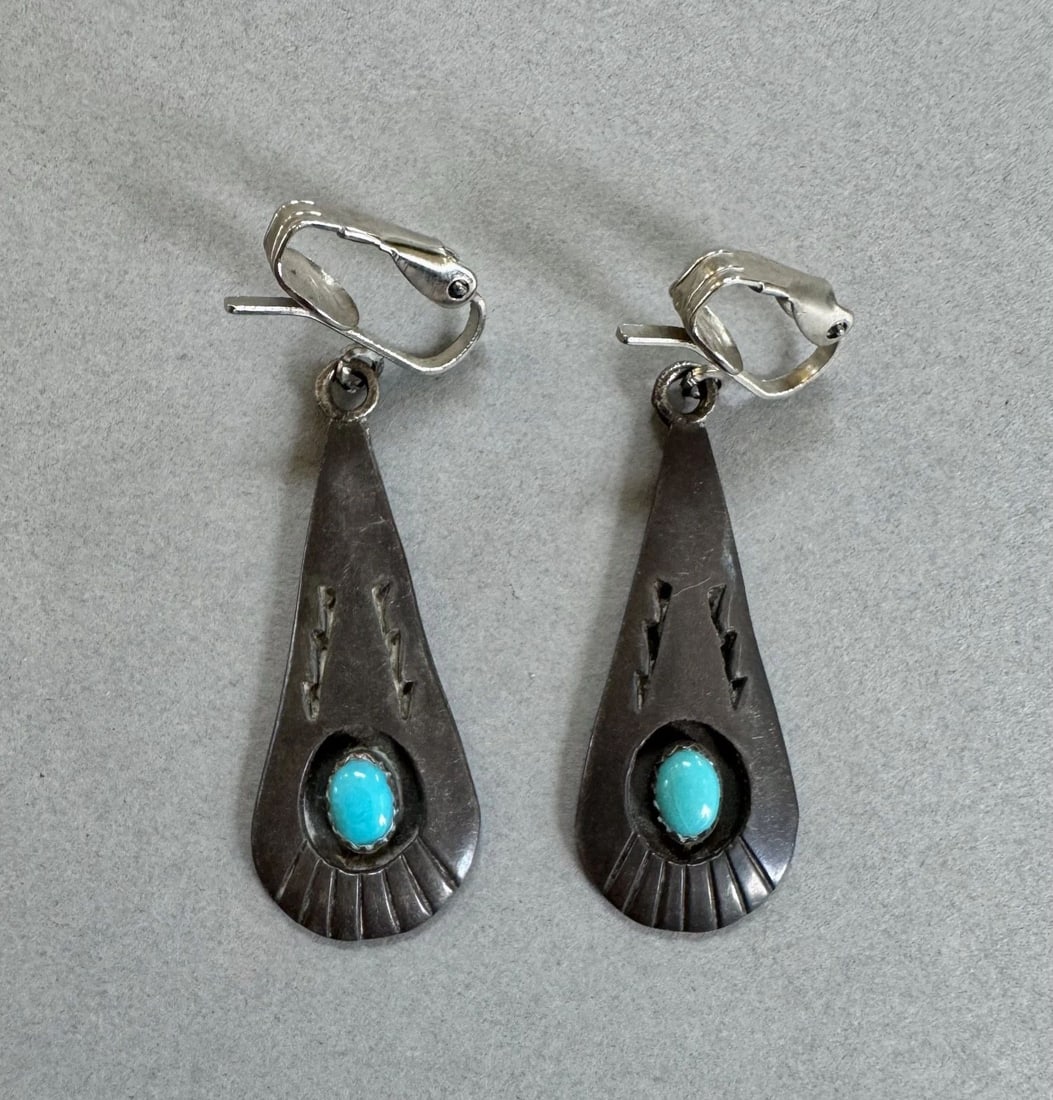 OLD PAWN NAVAJO STERLING SILVER AND TURQUOISE EARRINGS L. DICKENS: 1 1/2 " Tall 8.7 Grams Signed L.Dickens Throughout the 40 years that I have been in business, I have purchased jewelry from pawn shops throughout the Southwest that had collections of dead pawn. Most 