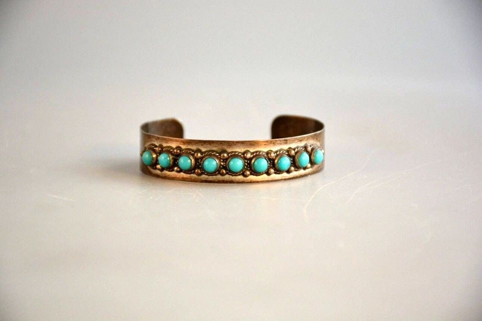 OLD PAWN STERLING SILVER BRACELET - TURQUOISE .MEXICO - EAGLE 23 - 6 1/8": OLD PAWN STERLING SILVER BRACELET - TURQUOISE .MEXICO - EAGLE 23 - 6 1/8" Item Description: This vintage sterling silver bracelet has nine turquoise stones surrounded with twisted silver wire and silv