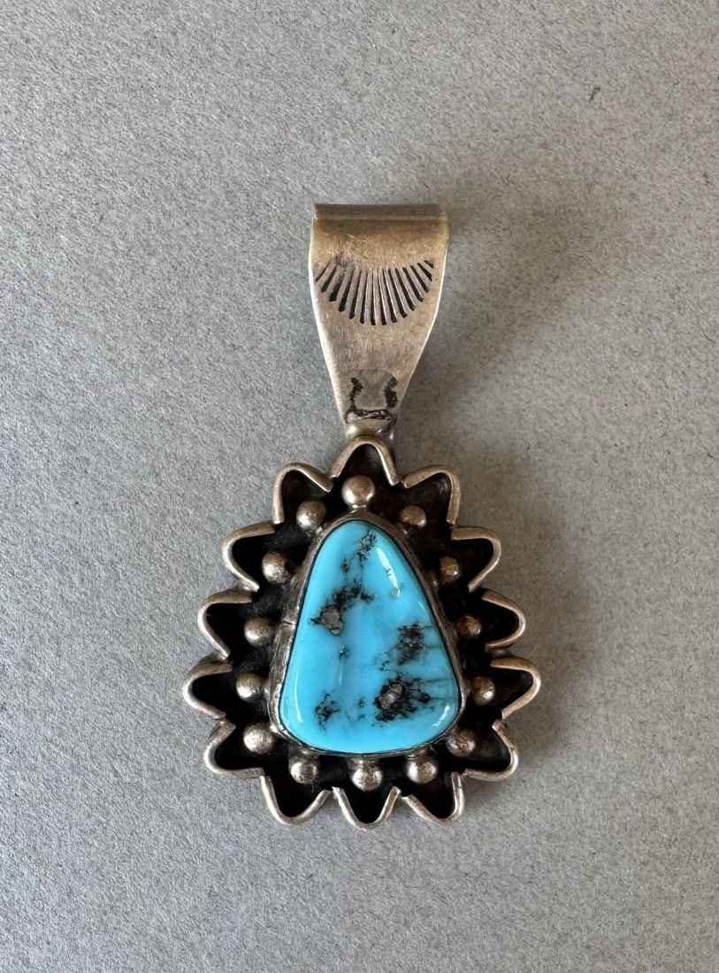 VINTAGE NAVAJO STERLING SILVER AND TURQUOISE PENDANT 1 1/2 ": 1 1/2 " tall 6.8 Grams Throughout the 40 years that I have been in business, I have purchased jewelry from pawn shops throughout the Southwest that had collections of dead pawn. Most of these pawn sho