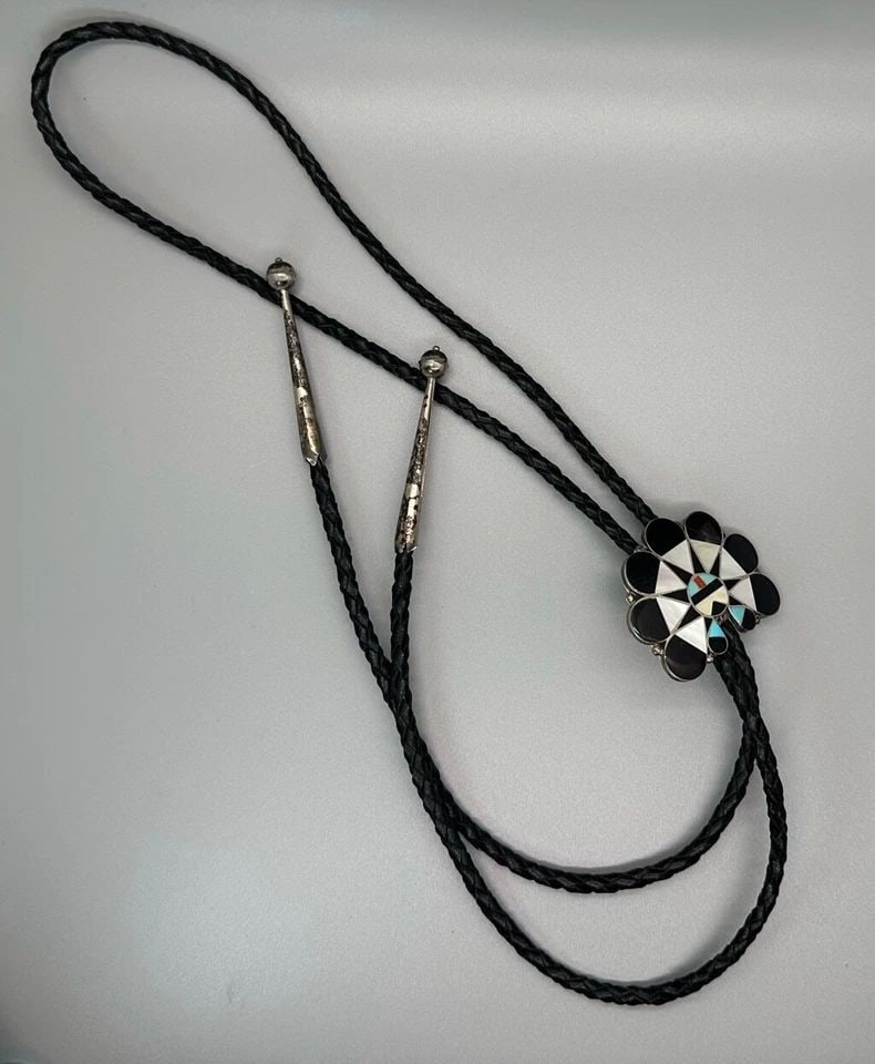 VINTAGE SUN FACE ZUNI INLAYED BOLO TIE: VINTAGE SUN FACE ZUNI INLAYED BOLO TIE Item Description: 1 1/2" Tall x 1 3/4 " Wide ..