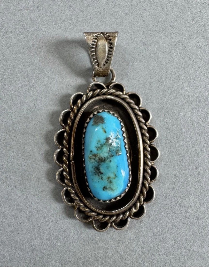 OLD PAWN NAVAJO STERLING SILVER AND TURQUOISE PENDANT: 1 3/4 " Tall 1" Wide 9.8 Grams Throughout the 40 years that I have been in business, I have purchased jewelry from pawn shops throughout the Southwest that had collections of dead pawn. Most of these 