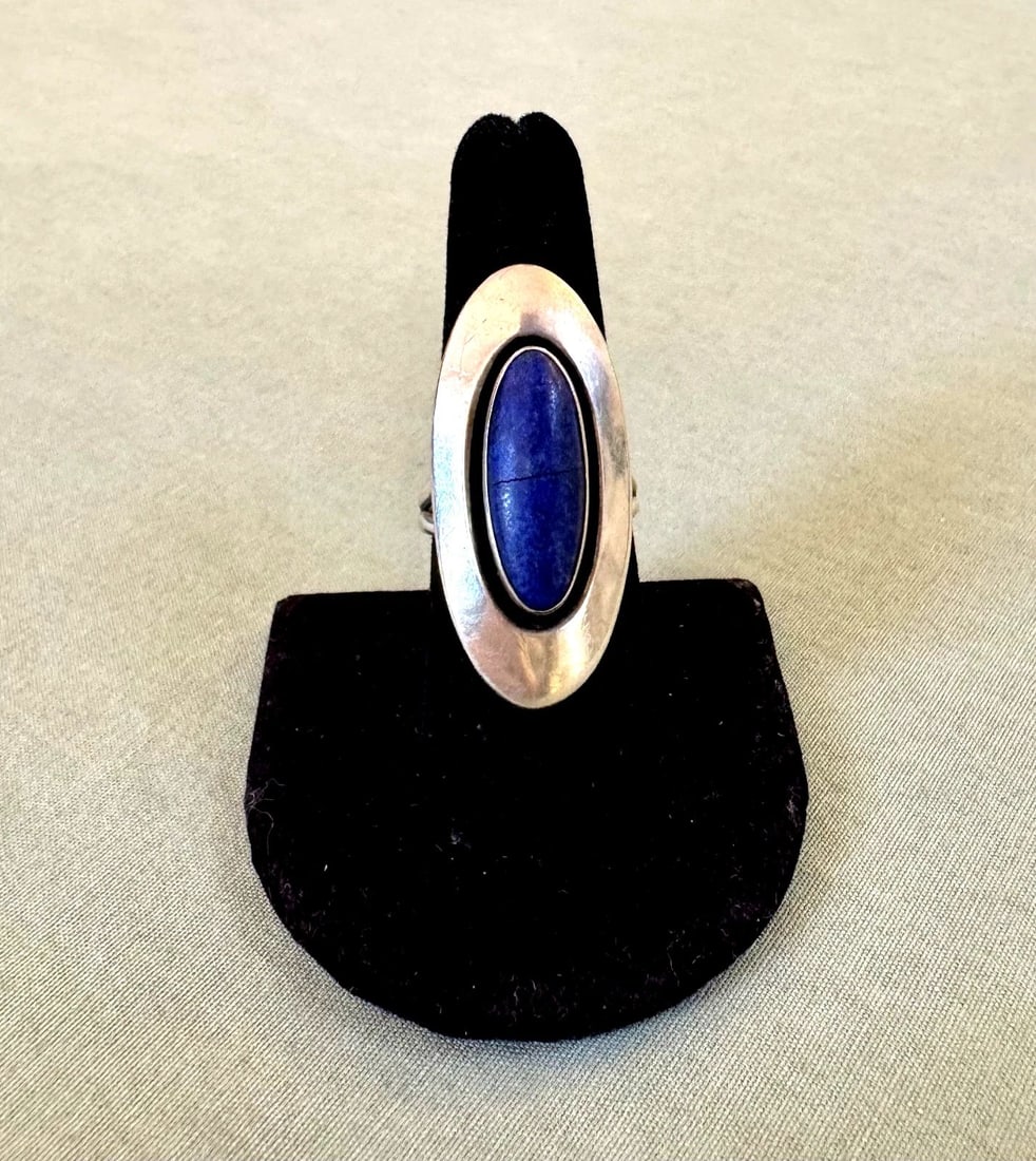 VINTAGE NAVAJO STERLING SILVER AND LAPIS RING SIZE 8 1/2: 1 1/2 " Thin Hairline crack in stone Stone is Secure ..Sighned H Throughout the 40 years that I have been in business, I have purchased jewelry from pawn shops throughout the Southwest that had collec