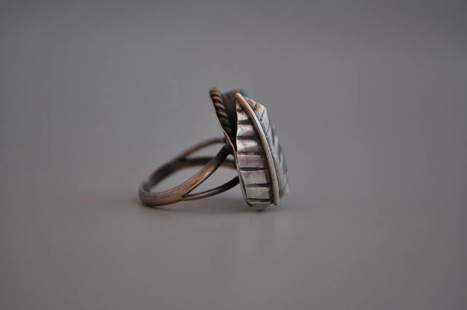 OLD PAWN NAVAJO STERLING SILVER RING - TURQUOISE SIZE 5 1/4: OLD PAWN NAVAJO STERLING SILVER RING - TURQUOISE SIZE 5 1/4 weight 6.87 Grams 7/8 " Tall Old Pawn Jewelry dates from the early 1900s to the 1970s. Most of it is not signed because it wasn't the Native