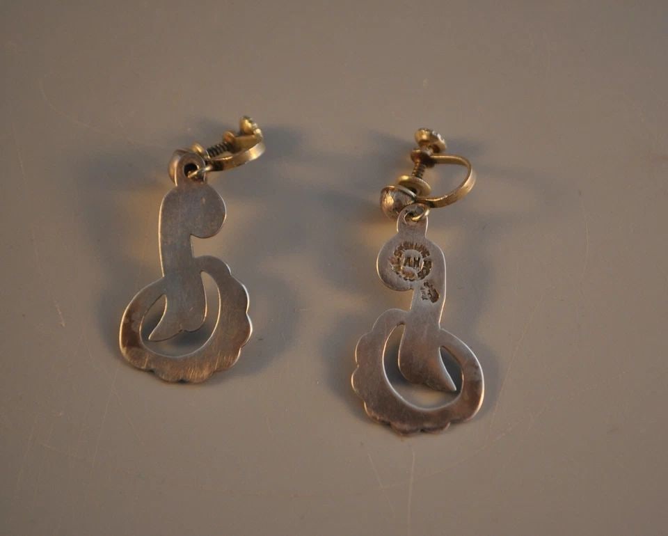 VINTAGE MEXICO STERLING SILVER 1 1/2" DANGLE EARRINGS - EAGLE 3 AH: Item Description: This pair of vintage Mid Century sterling silver earrings have a graceful curved design. The measure 1 1/2" long and have the vintage screwback clasps which are copper . The back of 