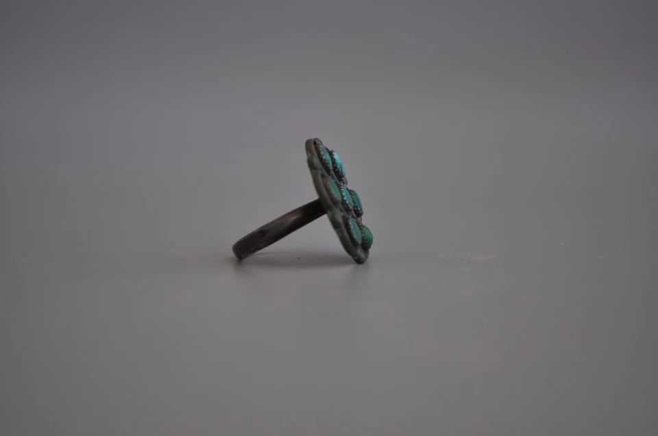 OLD PAWN ZUNI SILVER RING - TURQUOISE SIZE 6 3/4: OLD PAWN ZUNI SILVER RING - TURQUOISE SIZE 6 3/4 Weight 5.34 Grams 1 " Tall Old Pawn Jewelry dates from the early 1900s to the 1970s. Most of it is not signed because it wasn't the Native American tra