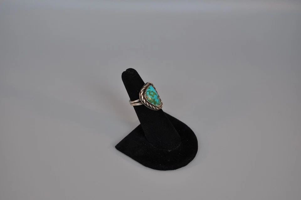 OLD PAWN NAVAJO STERLING SILVER RING - TURQUOISE SIZE 4 1/2: OLD PAWN NAVAJO STERLING SILVER RING - TURQUOISE SIZE 4 1/2 Weight 6.31 Grams 7/8" Tall Old Pawn Jewelry dates from the early 1900s to the 1970s. Most of it is not signed because it wasn't the