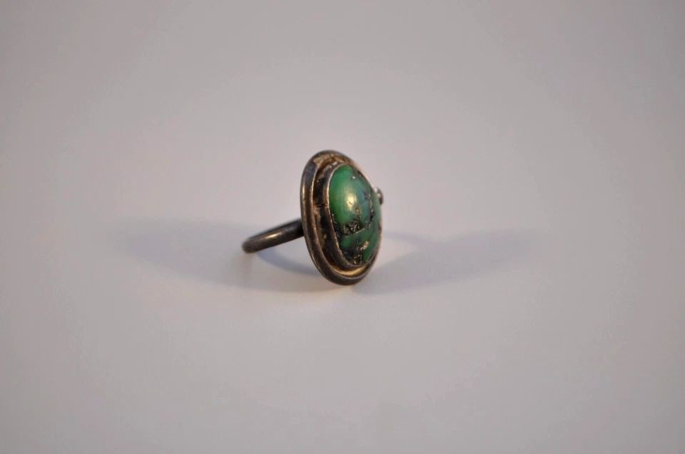 OLD PAWN NAVAJO STERLING SILVER RING - TURQUOISE SIZE 7: OLD PAWN NAVAJO STERLING SILVER RING - TURQUOISE SIZE 7 Weight 8.81 Grams 1" Tall Old Pawn Jewelry dates from the early 1900s to the 1970s. Most of it is not signed because it wasn't the