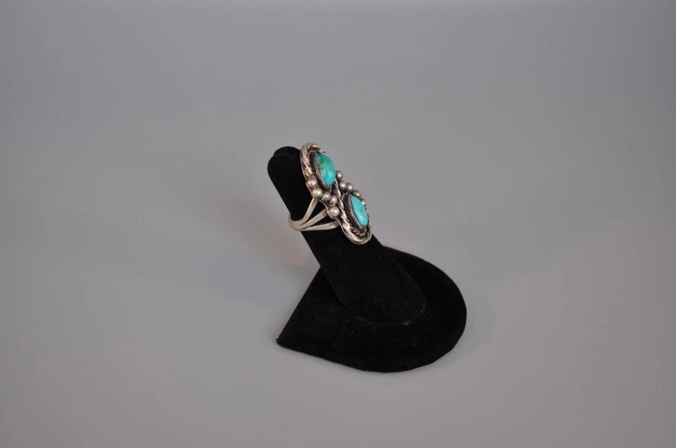 OLD PAWN NAVAJO SILVER RING - TURQUOISE SIZE 4 1/2: OLD PAWN NAVAJO SILVER RING - TURQUOISE SIZE 4 1/2 Weight 10.12 Grams 1 3/8" tall Old Pawn Jewelry dates from the early 1900s to the 1970s. Most of it is not signed because it wasn't the