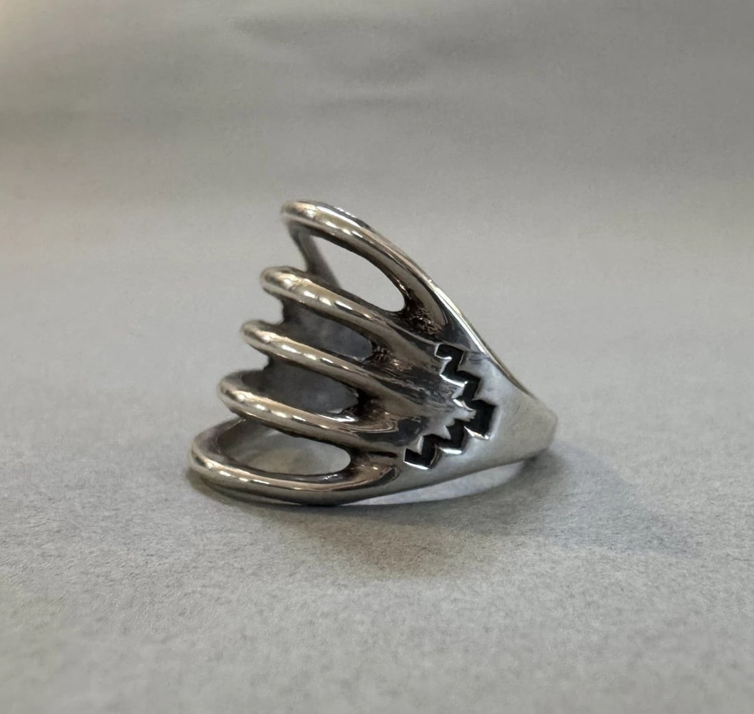 VINTAGE STERLING SILVER RING SIZE 7 1/4 SIGNED FL BEGAY: 5/8 " Wide Size 7 1/4 4.9 Grams Throughout the 40 years that I have been in business, I have purchased jewelry from pawn shops throughout the Southwest that had collections of dead pawn. Most of these