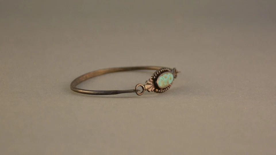 SOUTHWEST STERLING SILVER BANGLE BRACELET - TURQUOISE - BOMA - 7 5/8": SOUTHWEST STERLING SILVER BANGLE BRACELET - TURQUOISE - BOMA - 7 5/8" Item Description: This vintage sterling silver bangle bracelet has been set with an attractive turquoise stone. It has a hook clos