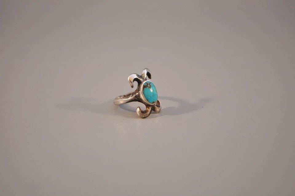 OLD PAWN NAVAJO CAST STERLING SILVER RING - TURQUOISE SIZE 5 3/4: OLD PAWN NAVAJO CAST STERLING SILVER RING - TURQUOISE SIZE 5 3/4 Weight 4.68 Grams.. 3/4" Tall Old Pawn Jewelry dates from the early 1900s to the 1970s. Most of it is not signed because it wasn't the 