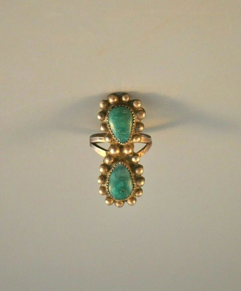 OLD PAWN VINTAGE NAVAJO INDIAN RING - 2 GREEN TURQUOISE STONES 1.5" TALL - 7.25: OLD PAWN VINTAGE NAVAJO INDIAN RING - 2 GREEN TURQUOISE STONES 1.5" TALL - 7.25 Item Description: This vintage Navajo silver ring came out of old pawn. It has 2 beautiful green turquoise stones surrou