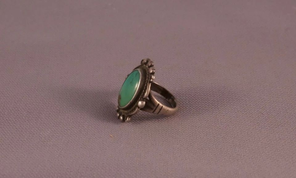 OLD PAWN NAVAJO STERLING SILVER AND TURQUOISE RING SIZE 4.75: OLD PAWN NAVAJO STERLING SILVER AND TURQUOISE RING SIZE 4.75 Item : 1" tall Old Pawn Vintage Navajo Indian Turquoise Ring. Great old turquoise ring with detailed silver work around stone.