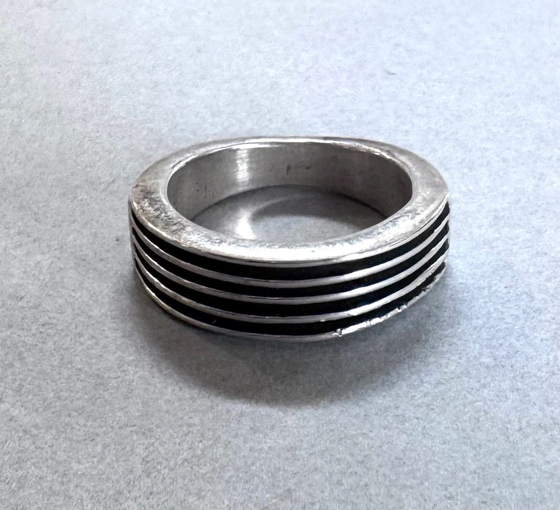 NAVAJO STERLING SILVER RING SIGNED FJ SIZE 6 3/4: 1/4 " wide ..6.9 grams Throughout the 40 years that I have been in business, I have purchased jewelry from pawn shops throughout the Southwest that had collections of dead pawn. Most of these pawn sho