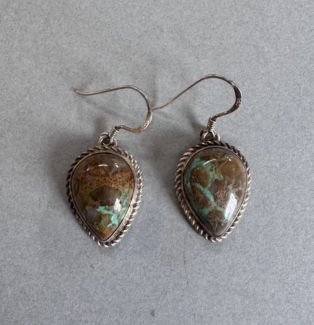 VINTAGE NAVAJO STERLING SILVER AND TURQUOISE EARRINGS SIGNED E: 1 1/4 " Drop 7.8 Grams Signed E Throughout the 40 years that I have been in business, I have purchased jewelry from pawn shops throughout the Southwest that had collections of dead pawn. Most of these