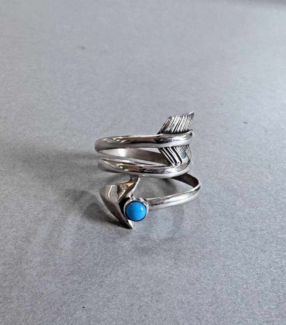 NAVAJO STERLING SILVER AND TURQUOISE ARROW RING SIZE 6: 3/4 " wide 3.9 Grams Throughout the 40 years that I have been in business, I have purchased jewelry from pawn shops throughout the Southwest that had collections of dead pawn. Most of these pawn shops