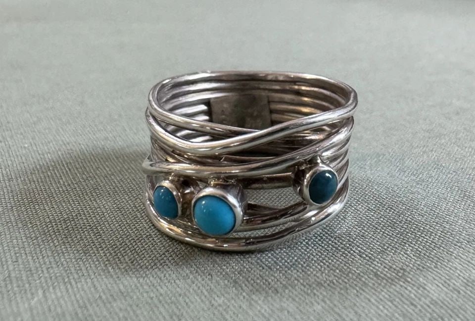 NAVAJO STERLING SILVER AND TURQUOISE RING SIZE 8 1/4: NAVAJO STERLING SILVER AND TURQUOISE RING SIZE 8 1/4 1/2" Wide ..7.8 Grams Throughout the 40 years that I have been in business, I have purchased jewelry from pawn shops throughout the Southwest that 