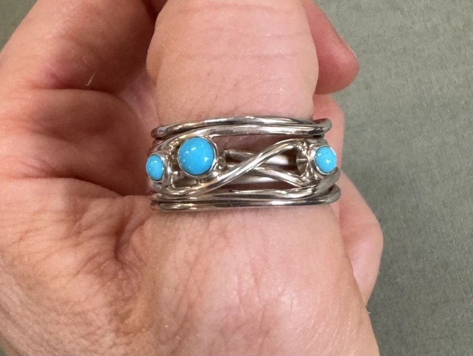 NAVAJO STERLING SILVER AND TURQUOISE RING SIZE 8 1/4 SIGNED: NAVAJO STERLING SILVER AND TURQUOISE RING SIZE 8 1/4 SIGNED 1/2 " Wide ..7.7 Grams Throughout the 40 years that I have been in business, I have purchased jewelry from pawn shops throughout the Southwe