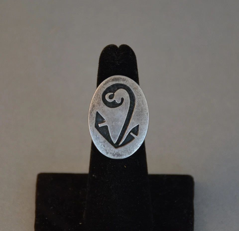 OLD PAWN HOPI STERLING ON STERLING SILVER RING - SEEDLING DESIGN - SIZE 5: OLD PAWN HOPI STERLING ON STERLING SILVER RING - SEEDLING DESIGN - SIZE 5 This vintage Hopi sterling silver shows a seedling design in silver on silver. The front of the ring is 1" tall and the ring i