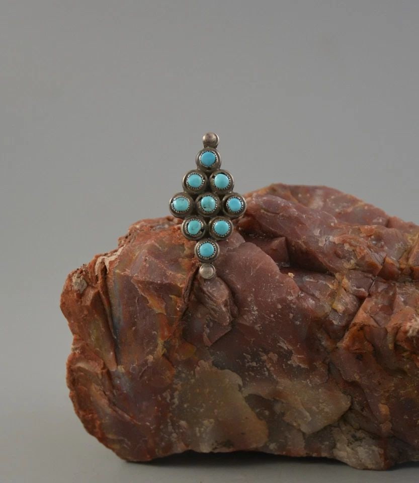 VINTAGE NAVAJO SILVER RING - 9 TURQUOISE STONES - SZ 5.5 - 1.5 TALL: VINTAGE NAVAJO SILVER RING - 9 TURQUOISE STONES - SZ 5.5 - 1.5 TALL This old Pawn Navajo silver ring has 9 turquoise stones set into a diamond shaped setting. The front of the ring is 1 1/2" tall. The