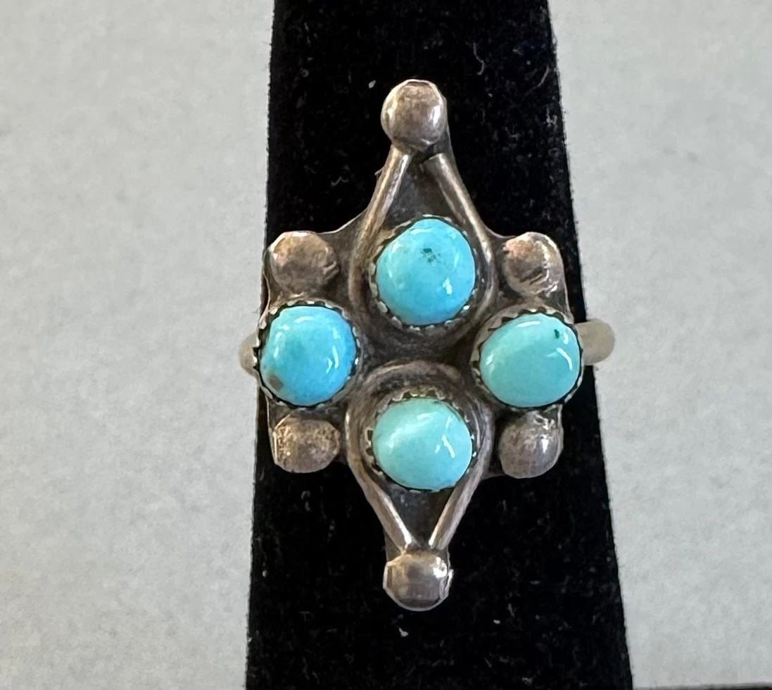 OLD PAWN ZUNI STERLING SILVER AND TURQUOISE RING SIZE 4 3/4: 7/8 " Tall 3 grams Throughout the 40 years that I have been in business, I have purchased jewelry from pawn shops throughout the Southwest that had collections of dead pawn. Most of these pawn shops a