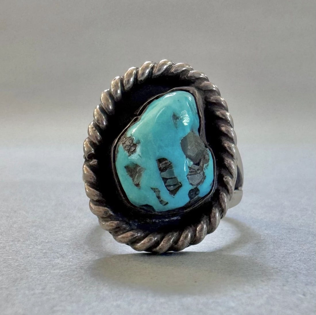 OLD PAWN NAVAJO STERLING SILVER AND TURQUOISE RING SIZE 7 1/4: 7/8 " Tall 7.2 Grams Throughout the 40 years that I have been in business, I have purchased jewelry from pawn shops throughout the Southwest that had collections of dead pawn. Most of these pawn shops