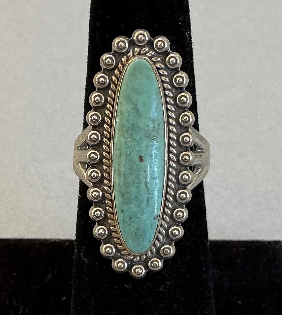 OLD PAWN NAVAJO STERLING SILVER AND TURQUOISE RING SIZE 6 1/4: 1 1/8 " Tall 7 Grams Throughout the 40 years that I have been in business, I have purchased jewelry from pawn shops throughout the Southwest that had collections of dead pawn. Most of these pawn shops