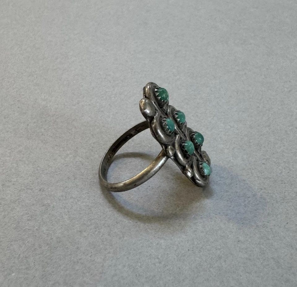 OLD PAWN ZUNI STERLING SILVER AND TURQUOISE RING SIZE 4: 7/8 " Tall 3.65 grams Throughout the 40 years that I have been in business, I have purchased jewelry from pawn shops throughout the Southwest that had collections of dead pawn. Most of these pawn shop