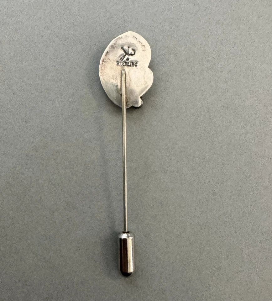 VINTAGE NAVAJO STERLING SILVER HAT PIN WITH GREEN JADE: 2 1/2 " Tall 1/2 " wide Throughout the 40 years that I have been in business, I have purchased jewelry from pawn shops throughout the Southwest that had collections of dead pawn. Most of these pawn sh