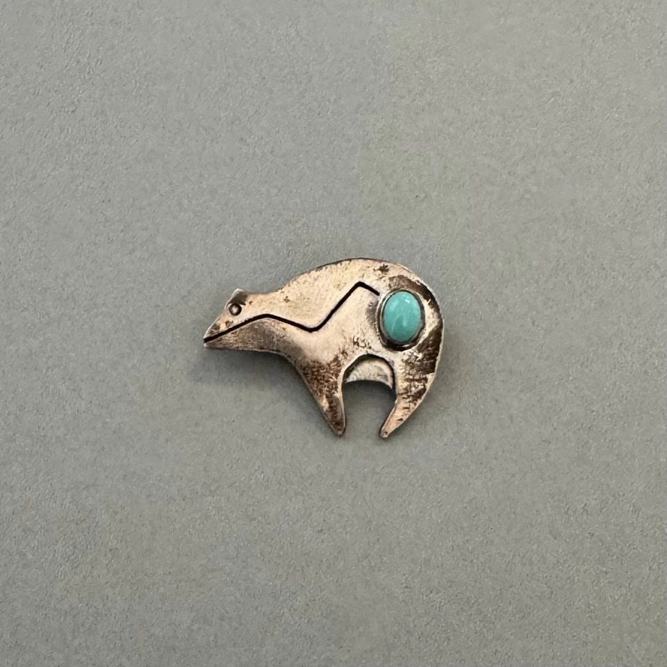 VINTAGE NAVAJO STERLING SILVER AND TURQUOISE BEAR PIN: 7/8 " Tall x 1 1/8 " wide 4.5 Grams Throughout the 40 years that I have been in business, I have purchased jewelry from pawn shops throughout the Southwest that had collections of dead pawn. Most of t