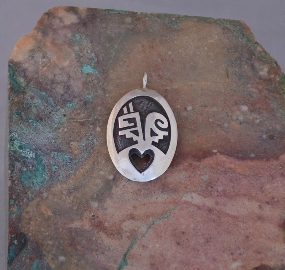 HOPI STERLING SILVER PENDANT - PAHO - PRAYER STICK WITH HEART - 1.25" TALL: HOPI STERLING SILVER PENDANT - PAHO - PRAYER STICK WITH HEART - 1.25" TALL This Hopi sterling silver pendant has been beautifully crafted. It shows a prayer stick with traditional Hopi symbols above a