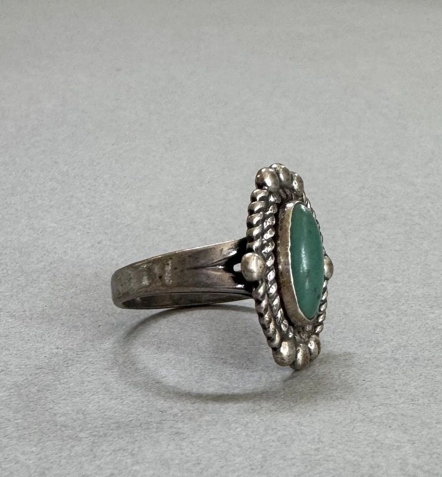 OLD PAWN NAVAJO STERLING SILVER AND TURQUOISE RING SIZE 7: 3/4 " Tall 4.2 Grams Throughout the 40 years that I have been in business, I have purchased jewelry from pawn shops throughout the Southwest that had collections of dead pawn. Most of these pawn shops