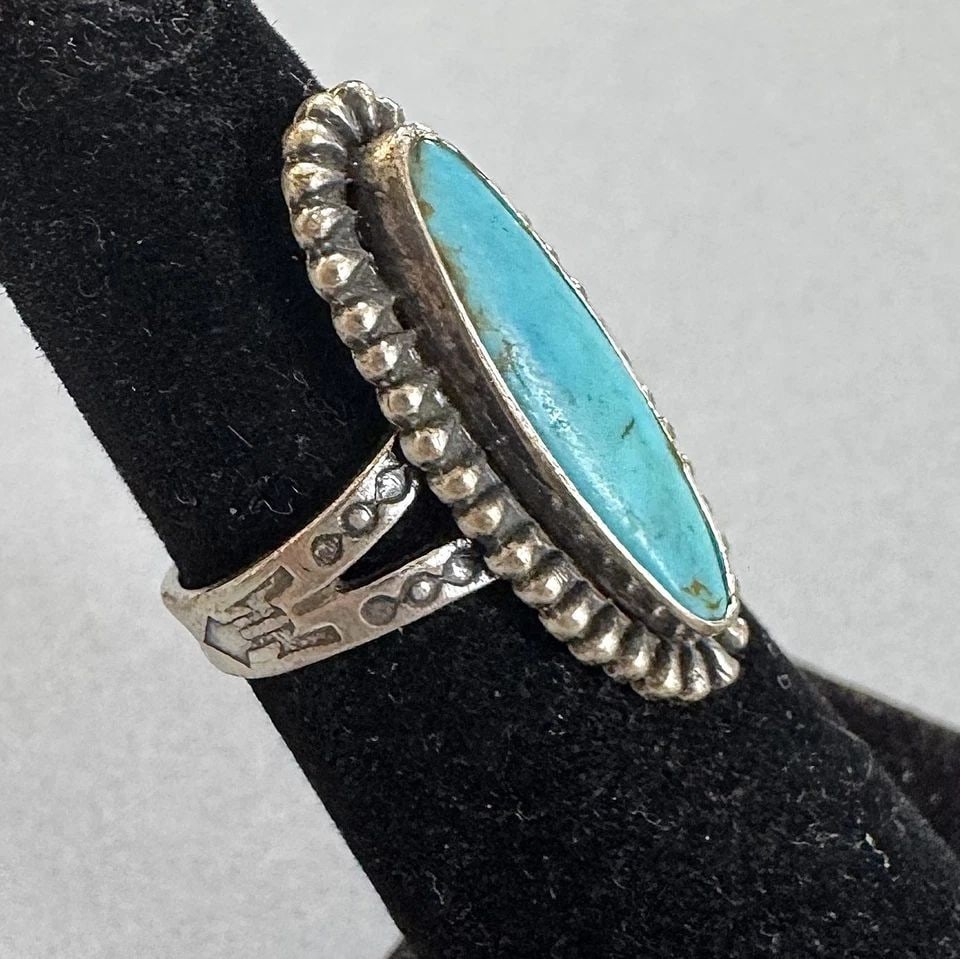 OLD PAWN NAVAJO STERLING SILVER AND TURQUOISE RING SIZE 4 1/2: 1 " Tall 4.3 Grams Throughout the 40 years that I have been in business, I have purchased jewelry from pawn shops throughout the Southwest that had collections of dead pawn. Most of these pawn shops a