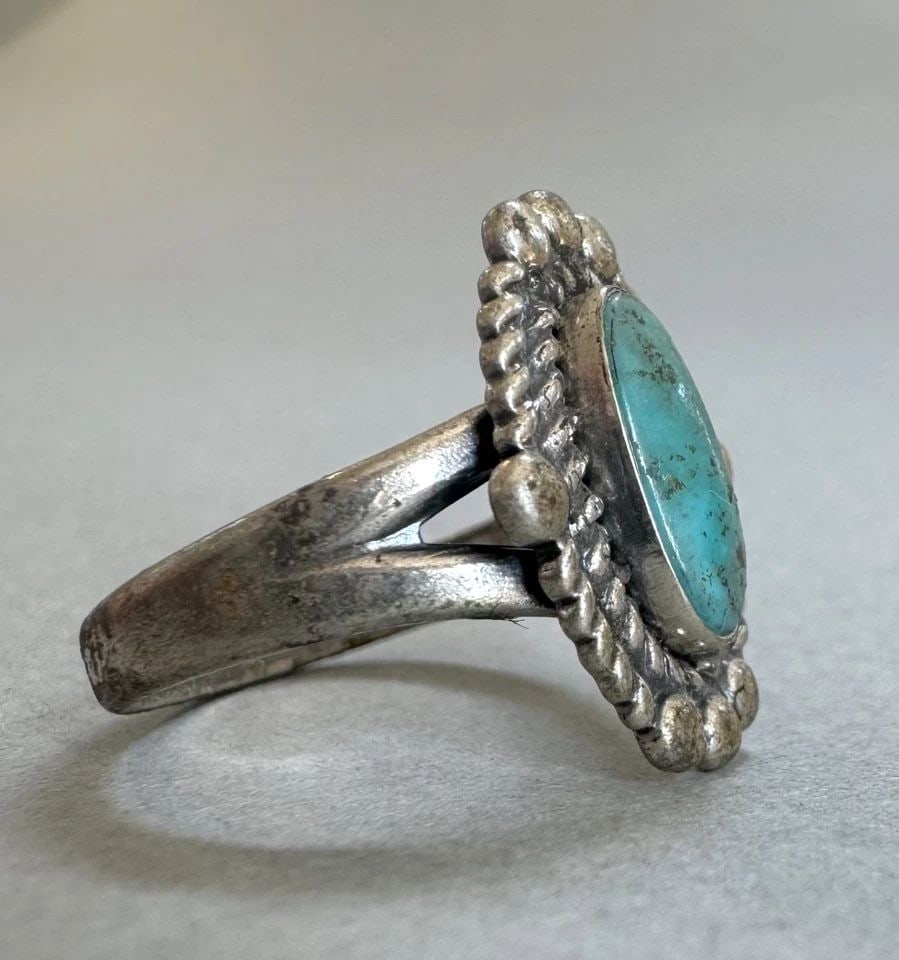 OLD PAWN NAVAJO STERLING SILVER AND TURQUOISE RING SIZE 7 3/4: 3/4 " tall 4 Grams Throughout the 40 years that I have been in business, I have purchased jewelry from pawn shops throughout the Southwest that had collections of dead pawn. Most of these pawn shops a