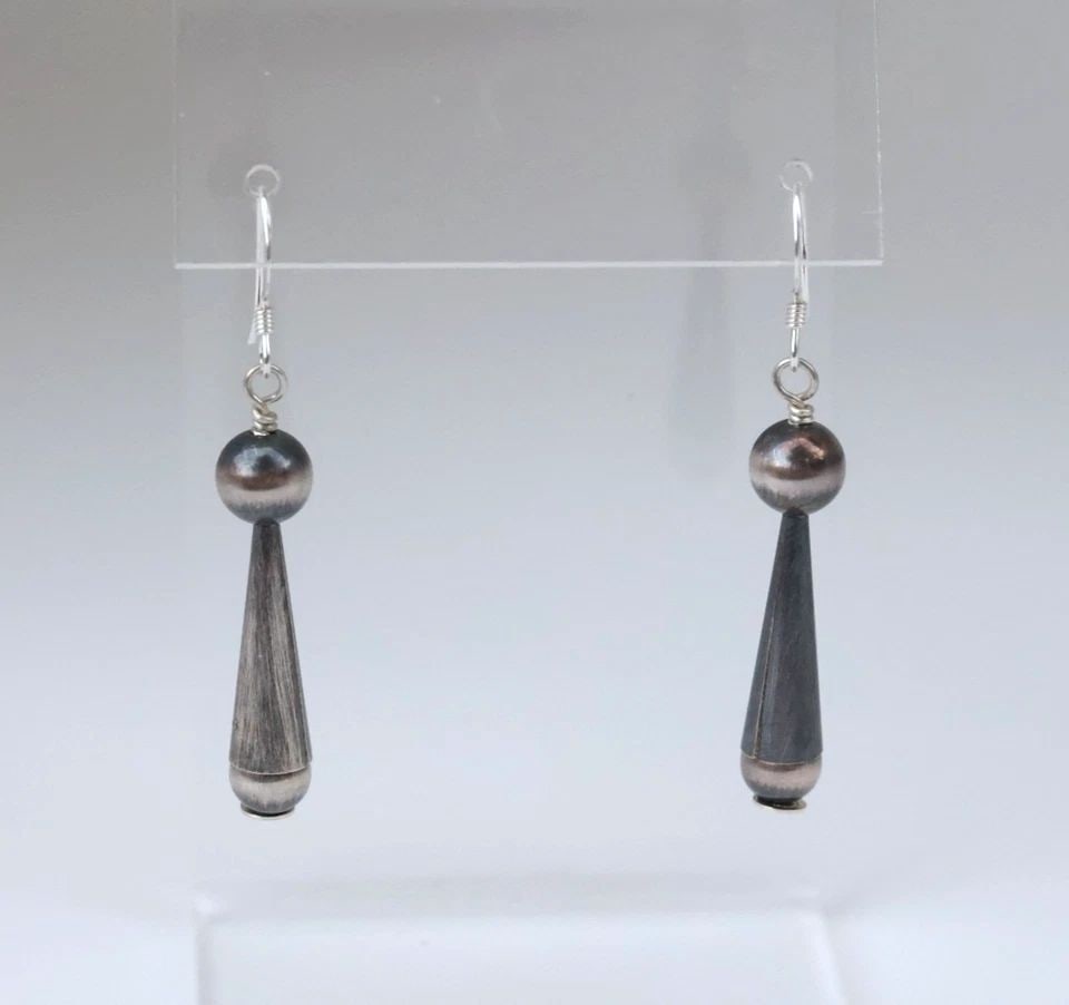 NAVAJO STERLING SILVER DANGLE EARRINGS - NAVAJO PEARLS - 1 3/4" DROP: This pair of sterling silver Navajo earrings have been beautifully crafted. They have a 1 3/4" drop from the ear and from top bead to bottom bead measure 1 1/8". They are in like new condition and hav