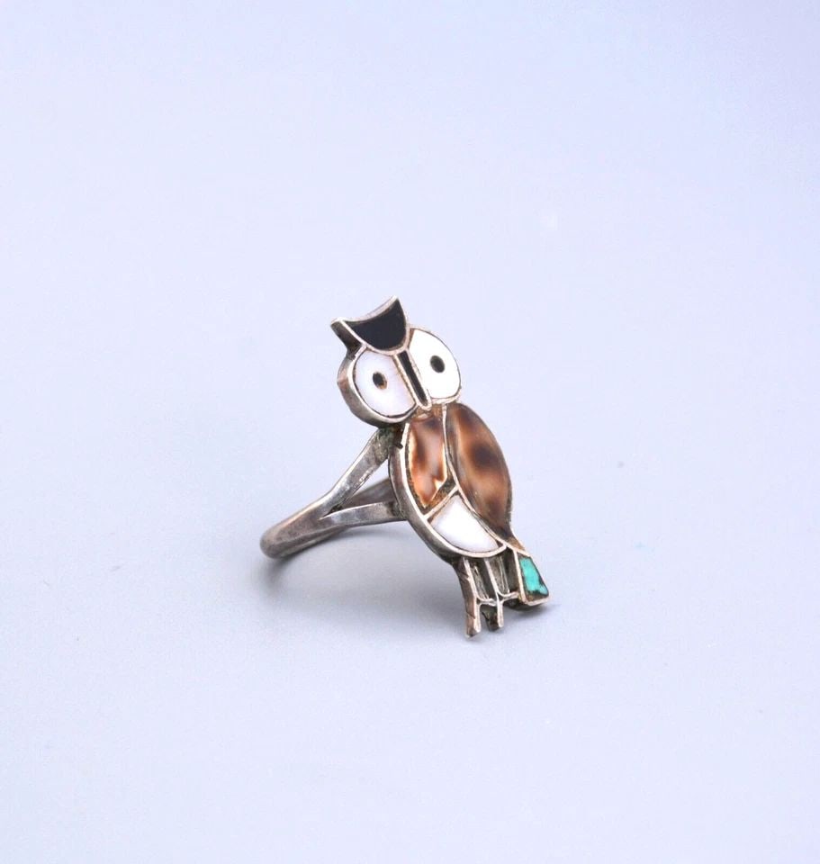 OLD PAWN ZUNI RING STERLING SILVER AND INLAID TURQUOISE, SHELL, ONYX SIZE 6.5: OLD PAWN ZUNI RING STERLING SILVER AND INLAID TURQUOISE, SHELL, ONYX SIZE 6.5 Item Description: 1 1/8" tall. Ring size is 6.5. This lovely vintage Zuni silver inlay owl ring is in great condition.