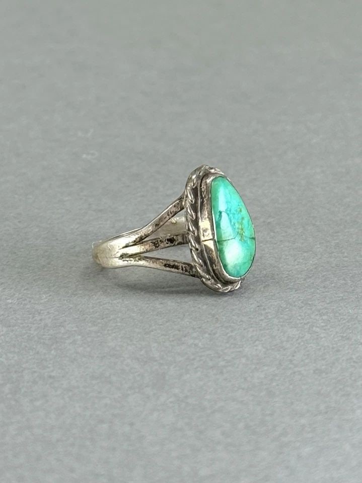 OLD PAWN NAVAJO STERLING SILVER WITH TURQUOISE RING. SIZE 6: OLD PAWN NAVAJO STERLING SILVER WITH TURQUOISE RING. SIZE 6 Old Pawn Navajo Sterling Silver with Turquoise Ring. Size 6 5/8” tall The Turquoise has a hairline crack, but the stone is secure.