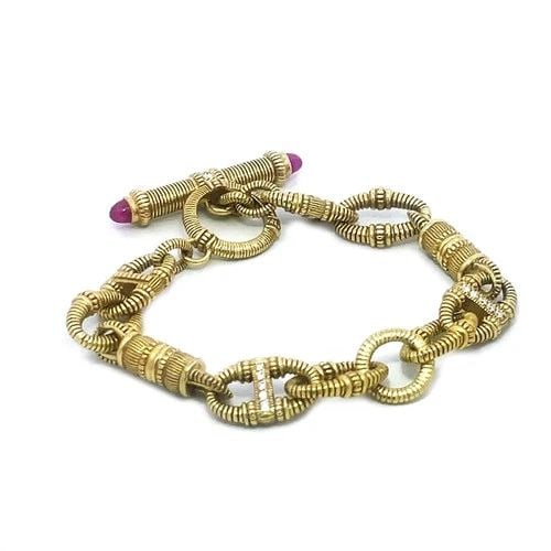 JUDITH RIPKA DIAMOND GOLD BRACELET 18K YELLOW TEXTURED DETACHABLE LINKS: JUDITH RIPKA DIAMOND GOLD BRACELET 18K YELLOW TEXTURED DETACHABLE LINKS Elevate your jewelry collection with this Judith Ripka bracelet, a stunning display of elegance and sophistication. Crafted from