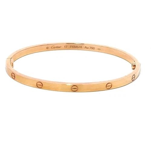 CARTIER LOVE GOLD BANGLE SMALL MODEL 18K ROSE SIZE 17 BOX & PAPER: CARTIER LOVE GOLD BANGLE SMALL MODEL 18K ROSE SIZE 17 BOX & PAPER This elegant bangle is by Cartier, from 18k rose gold, it features a screw closure and signed by the brand. This small model bangle, s