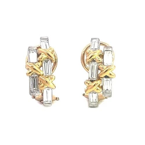DIAMOND CURVED HUGGIE EARRINGS 18K TWO TONE GOLD X DESIGN: DIAMOND CURVED HUGGIE EARRINGS 18K TWO TONE GOLD X DESIGN This lovely pair of earrings are crafted from 18k white and yellow gold featuring a double row curved bar in white gold with emerald cut diamo