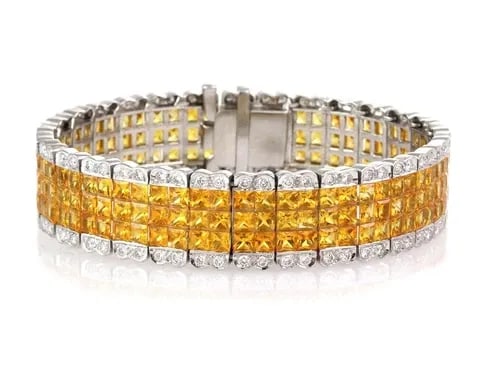 ESTATE 38.00CT YELLOW SAPPHIRE & DIAMOND 18K WHITE GOLD 15.2MM WIDE BRACELET: ESTATE 38.00CT YELLOW SAPPHIRE & DIAMOND 18K WHITE GOLD 15.2MM WIDE BRACELET Estate 38.00ct Yellow sapphire & Diamond 18k White Gold 15.2mm Wide Bracelet Description This is a fabulous diamond and cit