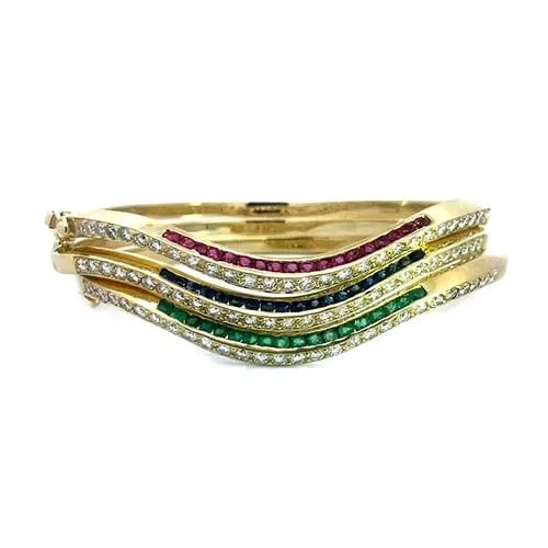 DIAMOND & GEMS GOLD BANGLES 18K YELLOW SET OF 3 HINGE BAND WAVE DESIGN: DIAMOND & GEMS GOLD BANGLES 18K YELLOW SET OF 3 HINGE BAND WAVE DESIGN These beautiful bangles are a set of three hinged bracelets crafted from 18k yellow gold. The front half of each bangle feature a