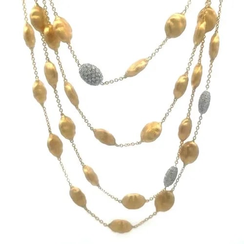 MARCO BICEGO SIVIGLIA GOLD NECKLACE DIAMOND 18K YELLOW BEAD MOTIFS 50" L: MARCO BICEGO SIVIGLIA GOLD NECKLACE DIAMOND 18K YELLOW BEAD MOTIFS 50" L From the Siviglia Collection, this eye-catching long Marco Bicego necklace is from 18k yellow gold with a shiny satin finish fe