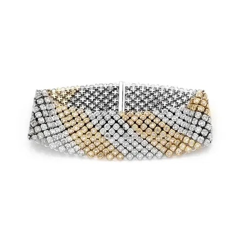 DIAMOND BRACELET 14K TWO TONE GOLD 24MM WIDE FLEXIBLE: DIAMOND BRACELET 14K TWO TONE GOLD 24MM WIDE FLEXIBLE This Diamond Bracelet in 14k Two Tone Gold is a stunning piece of fine jewelry. The 24mm wide flexible chain style bracelet features natural diamo