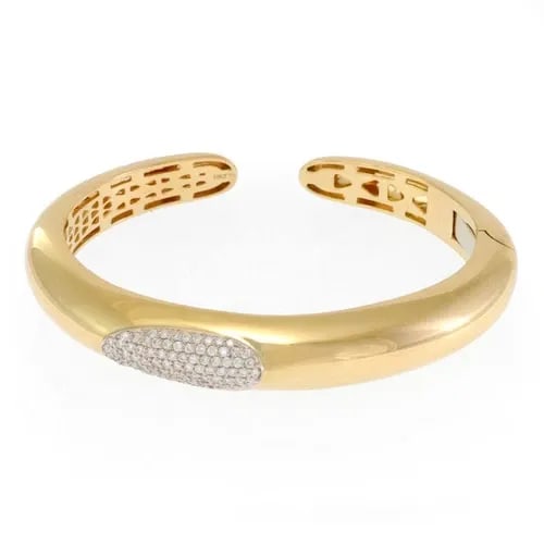 ROBERTO COIN CUFF BRACELET CAPRI PLUS DIAMOND 18K GOLD DOME KICK: The Roberto Coin Cuff Bracelet Capri Plus Diamond in 18k Gold Dome Kick is a luxurious and elegant piece of fine jewelry. Made in Italy, this cuff bracelet features a pavé setting style with a round 