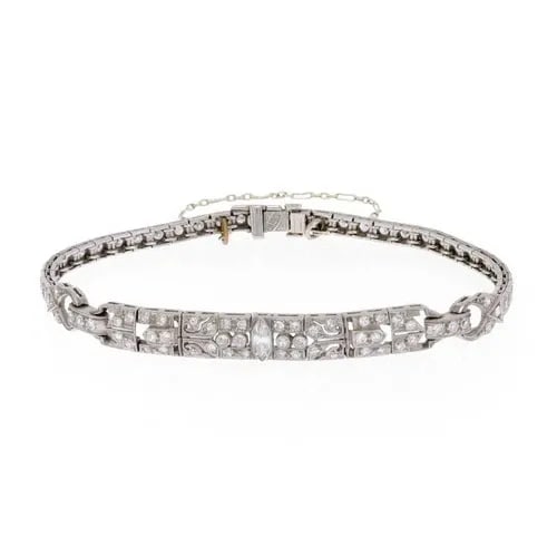 DIAMOND PLATINUM BRACELET FLORAL MILGRAIN DESIGN ART DECO: DIAMOND PLATINUM BRACELET FLORAL MILGRAIN DESIGN ART DECO This beautiful Art Deco bracelet is crafted from platinum, the 2.5 inches long centerpiece is 6.5mm wide with an open floral filigree style se